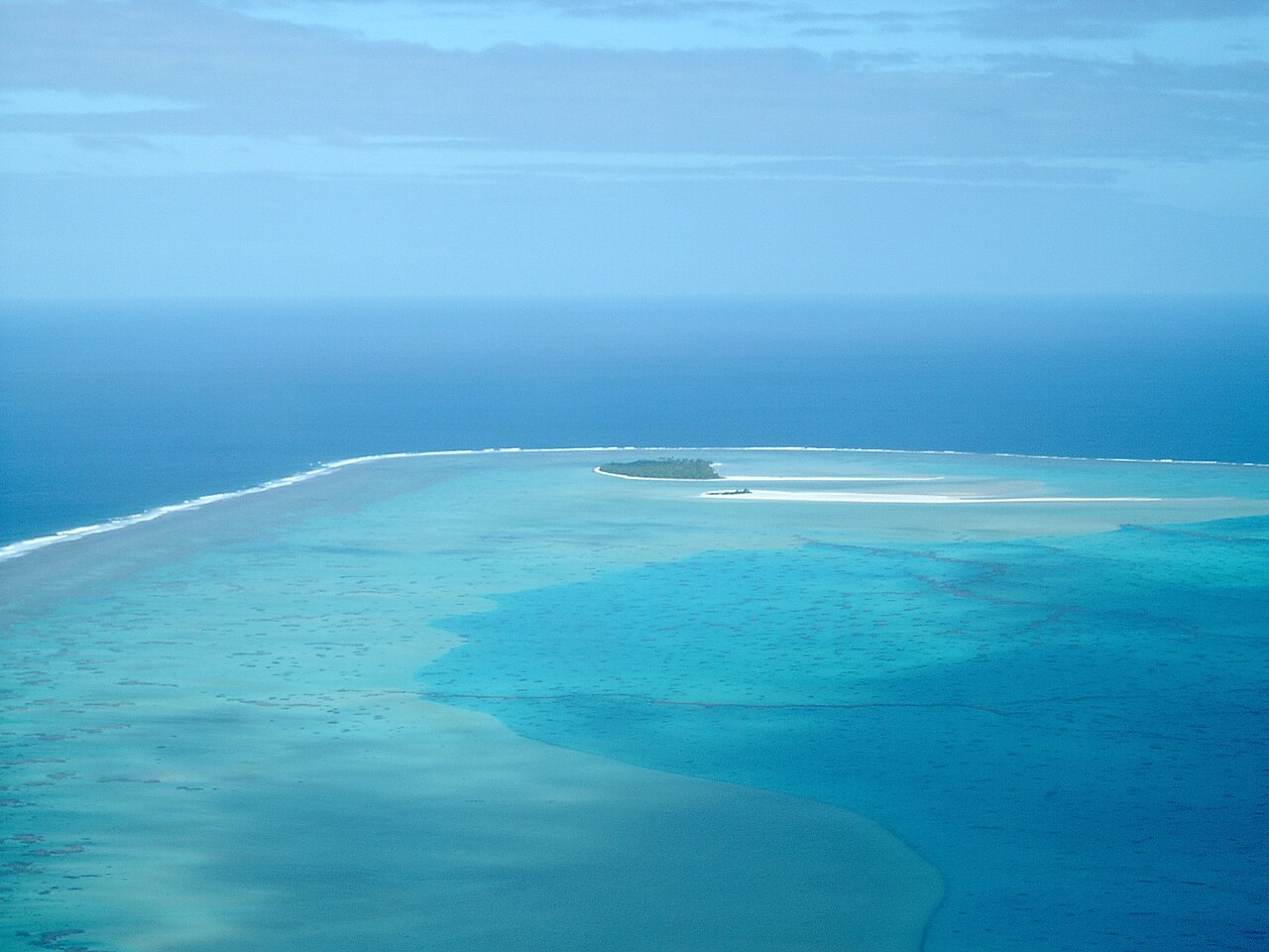 Colorful coral gardens and tropical fish in the crystal-clear waters of Aitutaki lagoon