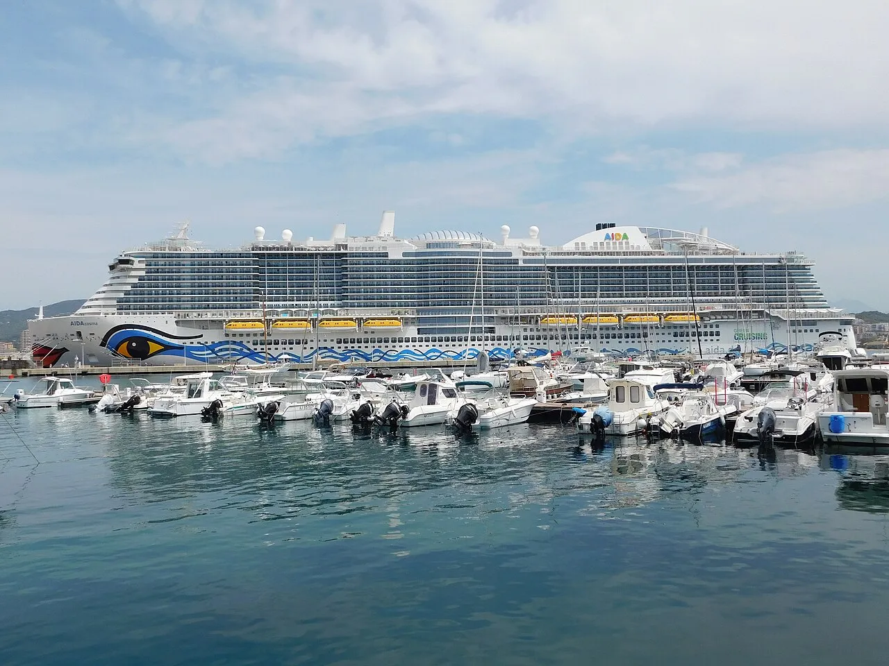 AIDAcosma behind local marina boats at Ajaccio