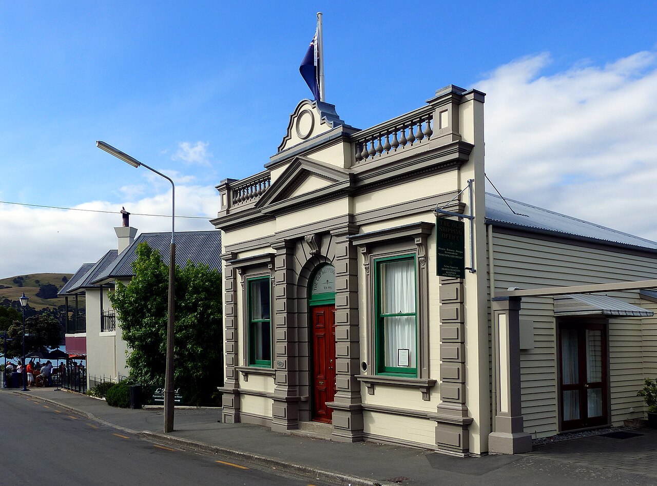 French-named street sign on Rue Lavaud in Akaroa village showing colonial architecture