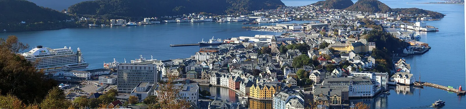 Aksla viewpoint panorama of Ålesund on sunny day with AIDA cruise ship in harbor