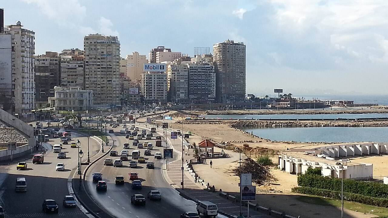 Alexandria Corniche waterfront boulevard stretching along Mediterranean coastline at sunset