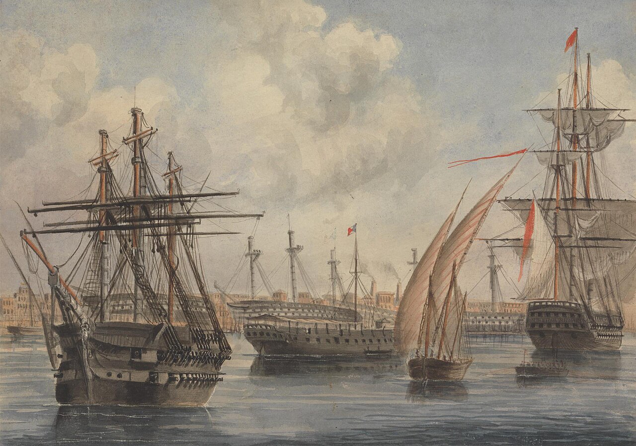 Alexandria Eastern Harbour with fishing boats and Mediterranean waterfront lined with historic buildings