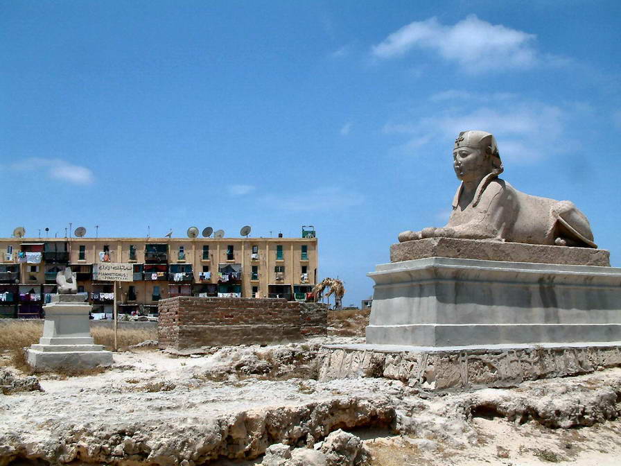 Great Sphinx of Giza with pyramid rising behind it in the Egyptian desert