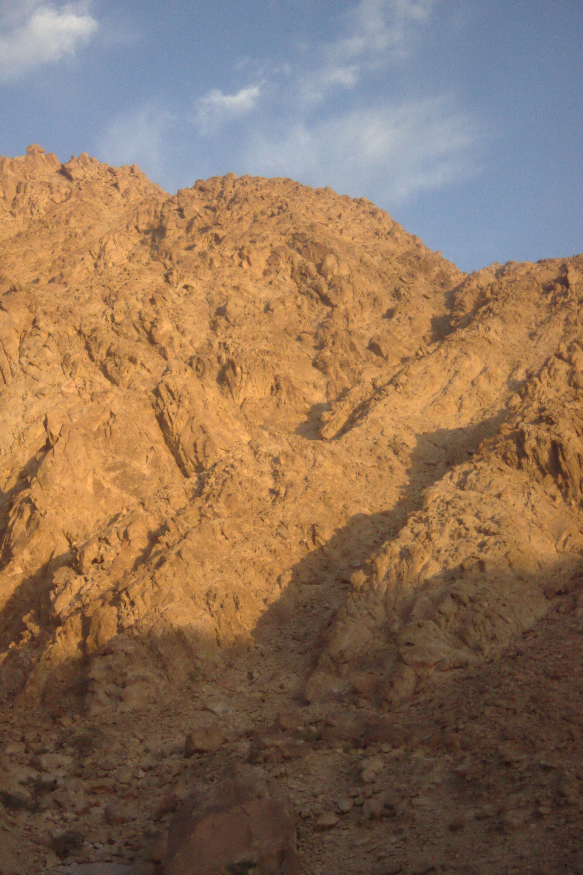 The Treasury at Petra carved into rose-red sandstone cliffs in the morning light