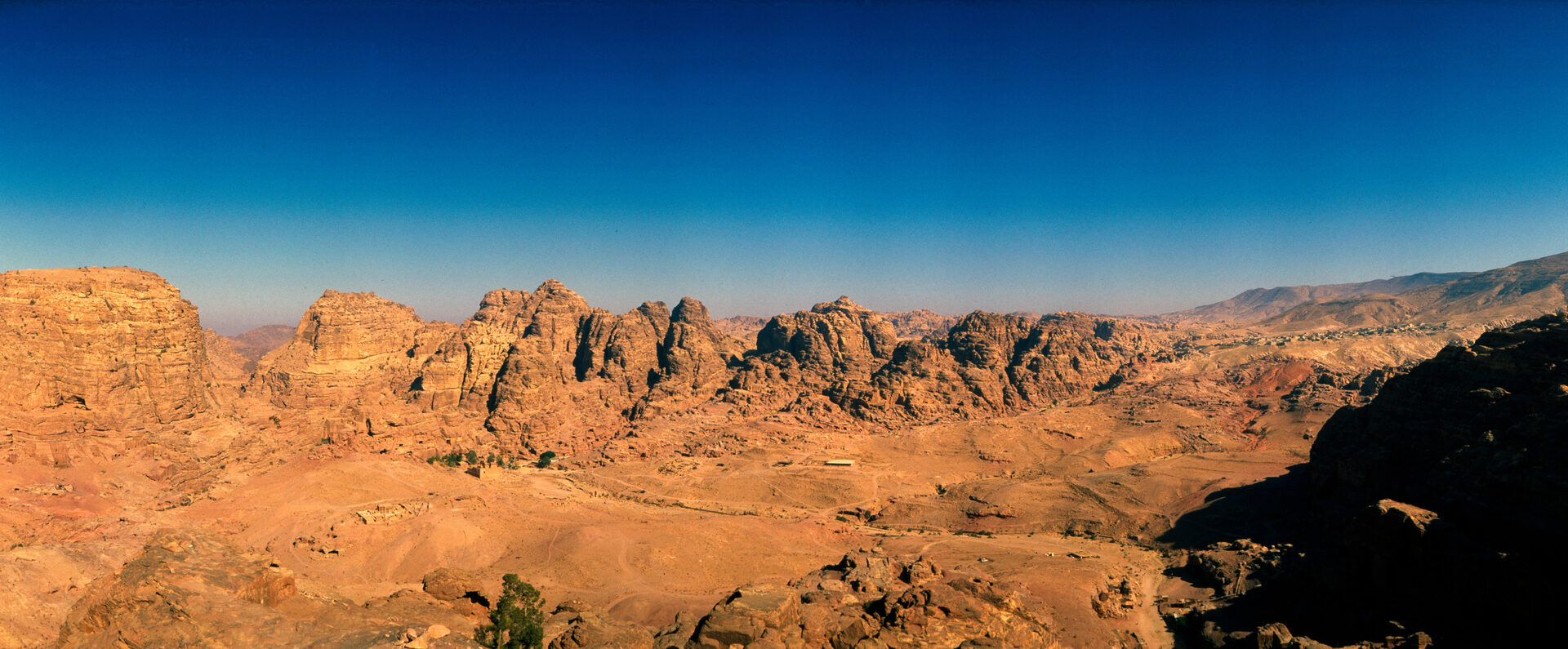 The Monastery at Petra carved into sandstone cliff face with dramatic scale