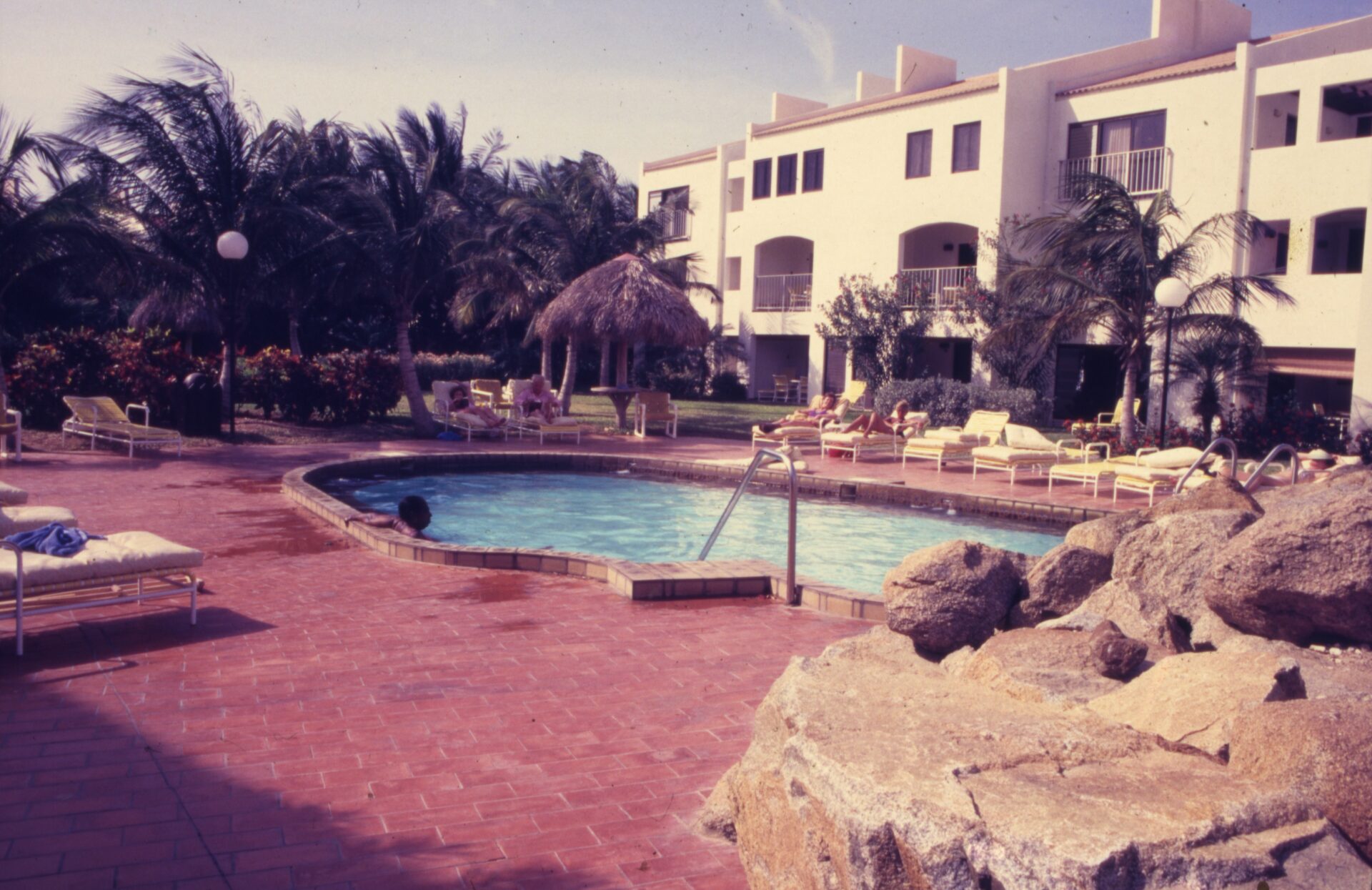 Modern Aruba cruise terminal building with ship docked at the pier