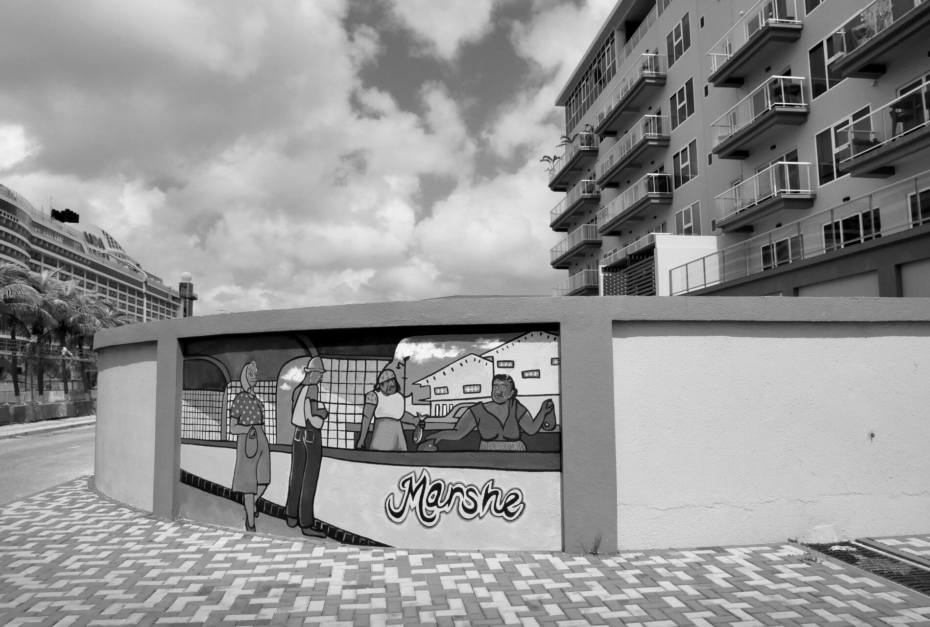 Swimmers in the Natural Pool surrounded by volcanic rock formations
