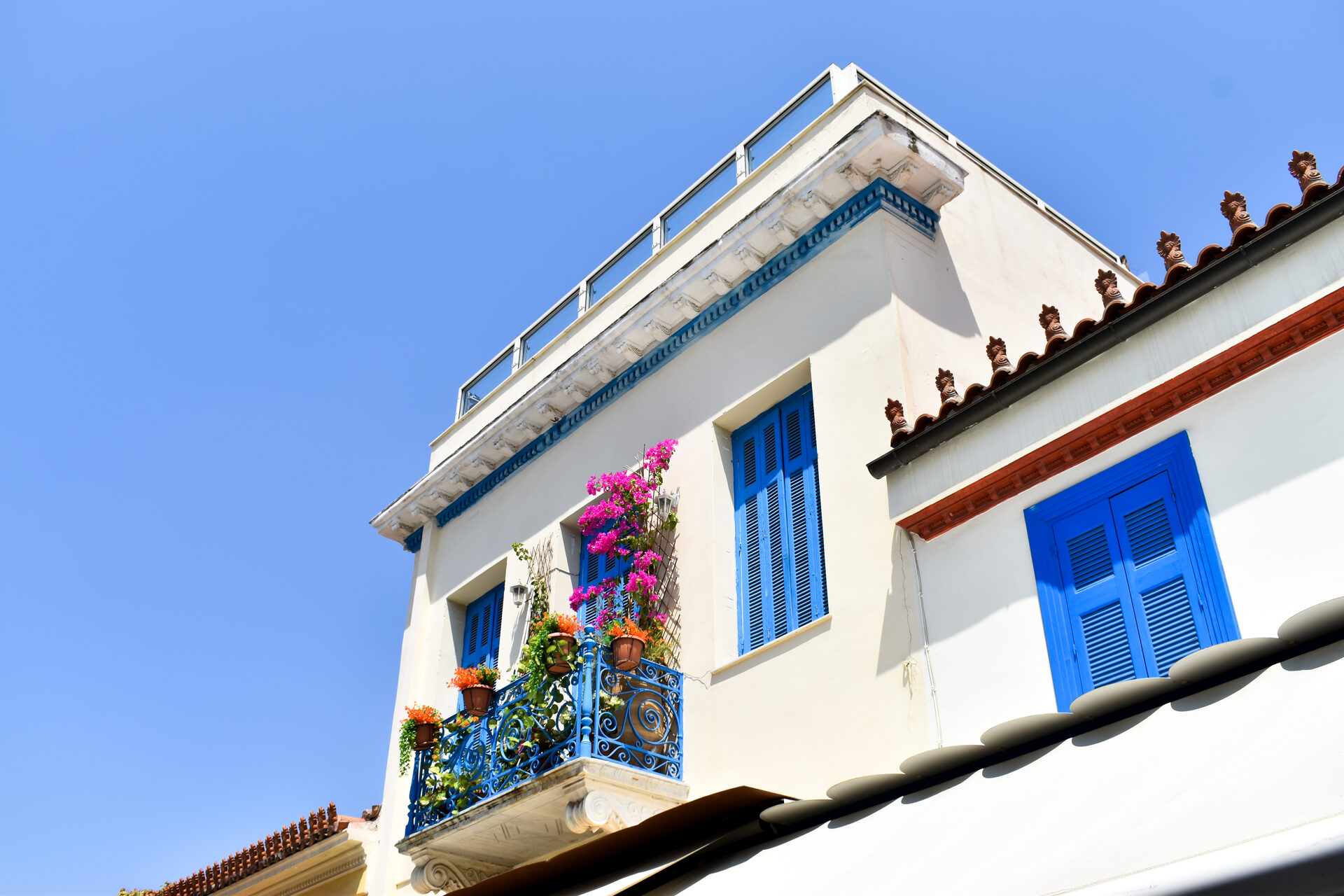 The Parthenon temple atop the Acropolis hill glowing golden at sunset over Athens