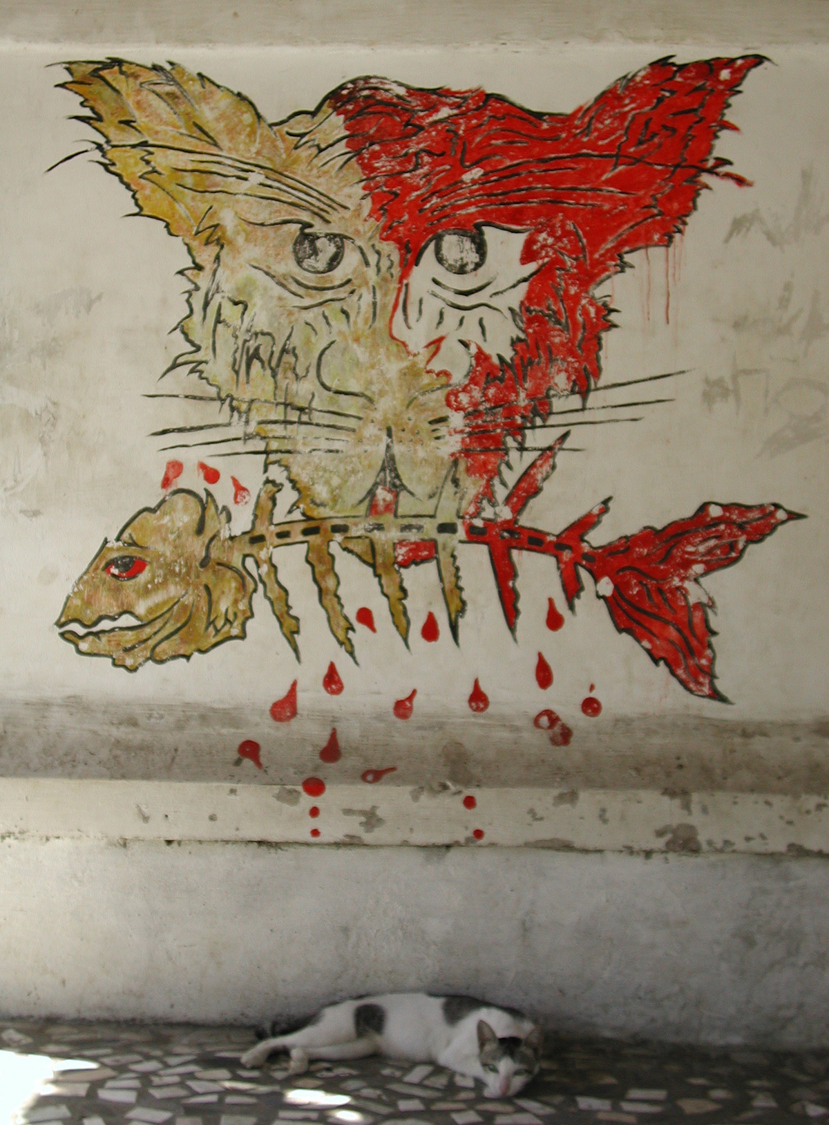 Tanah Lot temple silhouette on rock formation at sunset with crashing waves