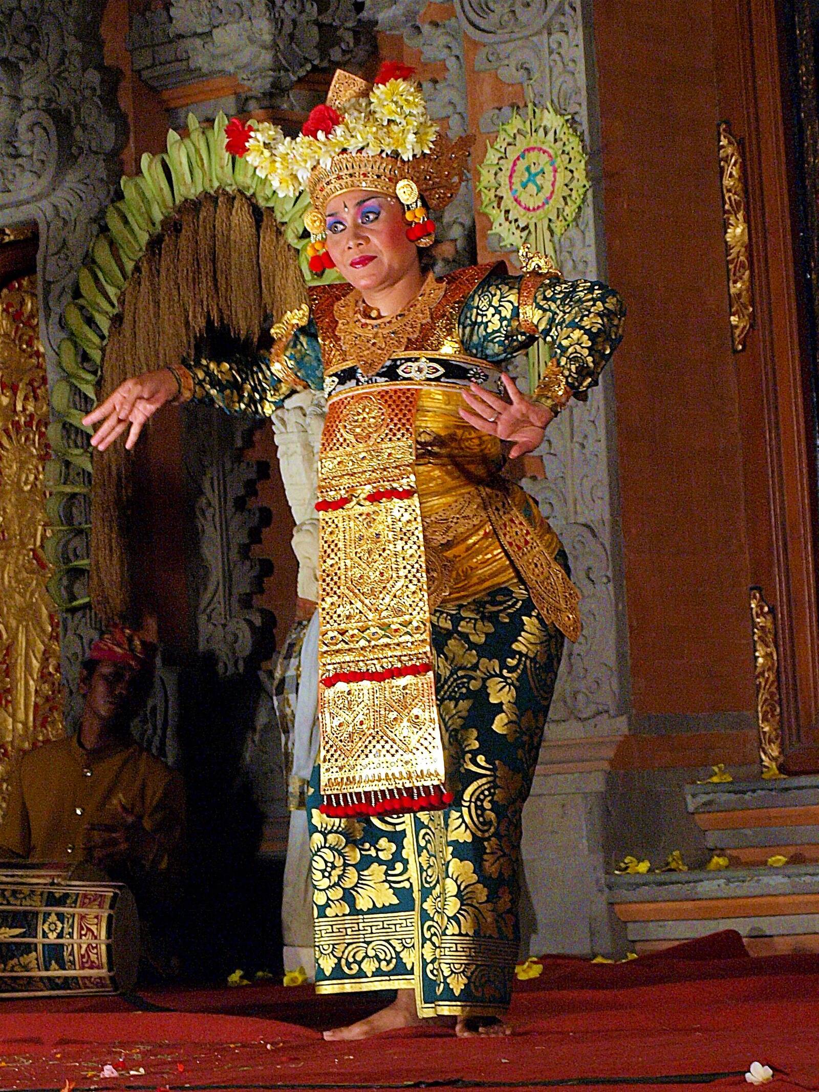 Seafood dinner tables on sand at Jimbaran Beach with sunset and grilled fish
