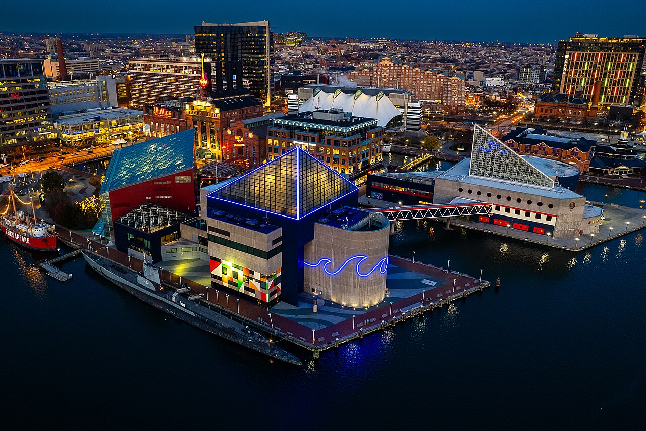 National Aquarium building on Inner Harbor waterfront with distinctive glass pyramid architecture
