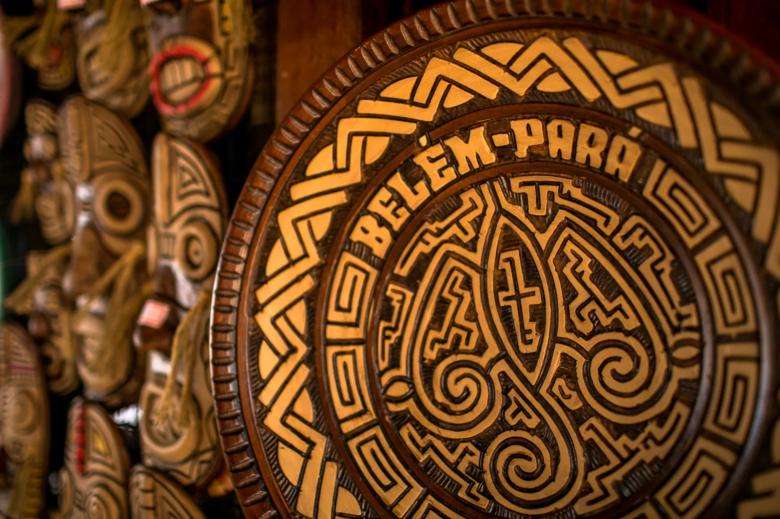 A potter's hands shaping Marajoara-style ceramics at a workshop in Icoaraci, Belém