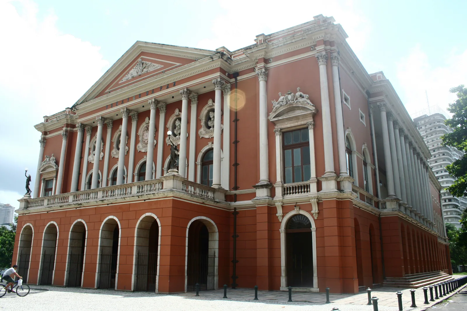 The Theatro da Paz at Belém seen across Praça da República, its portico and pediment above the trees of the square