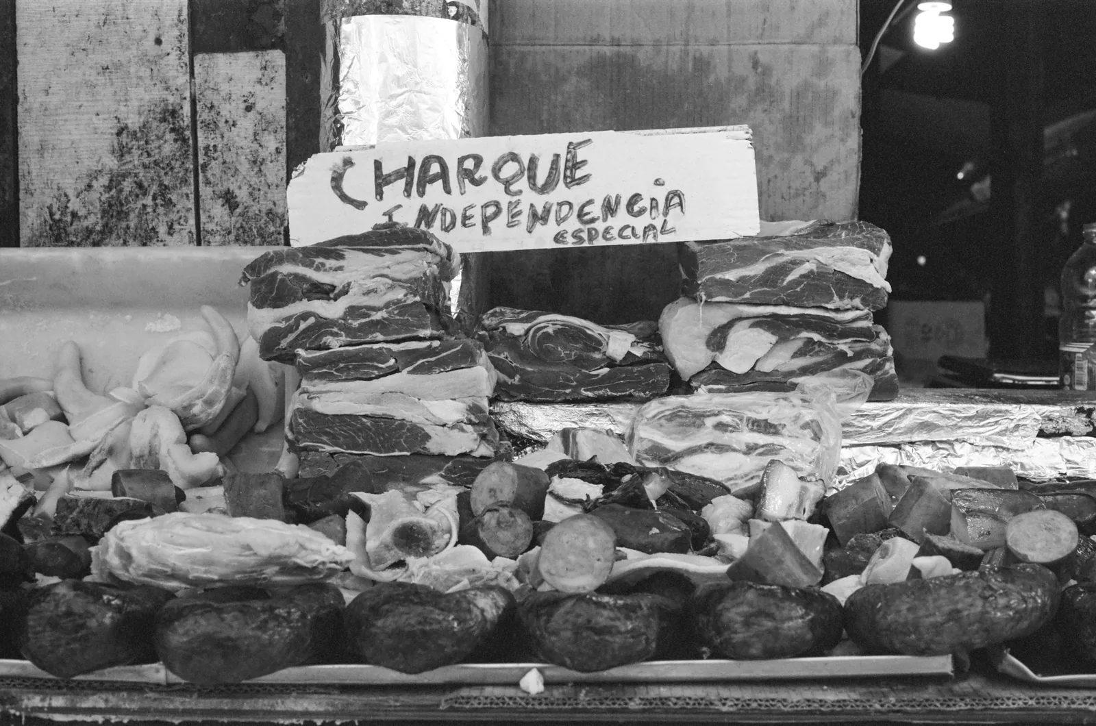 Salt-cured charque and sausages laid out on a butcher's slab in the Ver-o-Peso market at Belém
