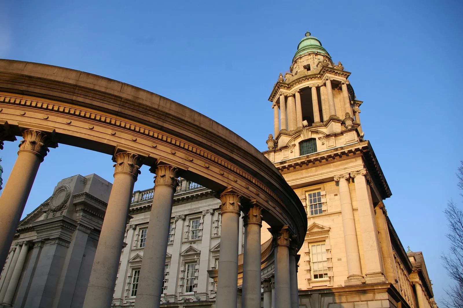 Peace wall separating neighborhoods in Belfast with murals and signatures from visitors