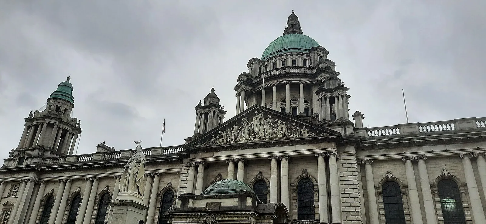 Hexagonal basalt columns of Giant's Causeway with waves crashing against the rocks