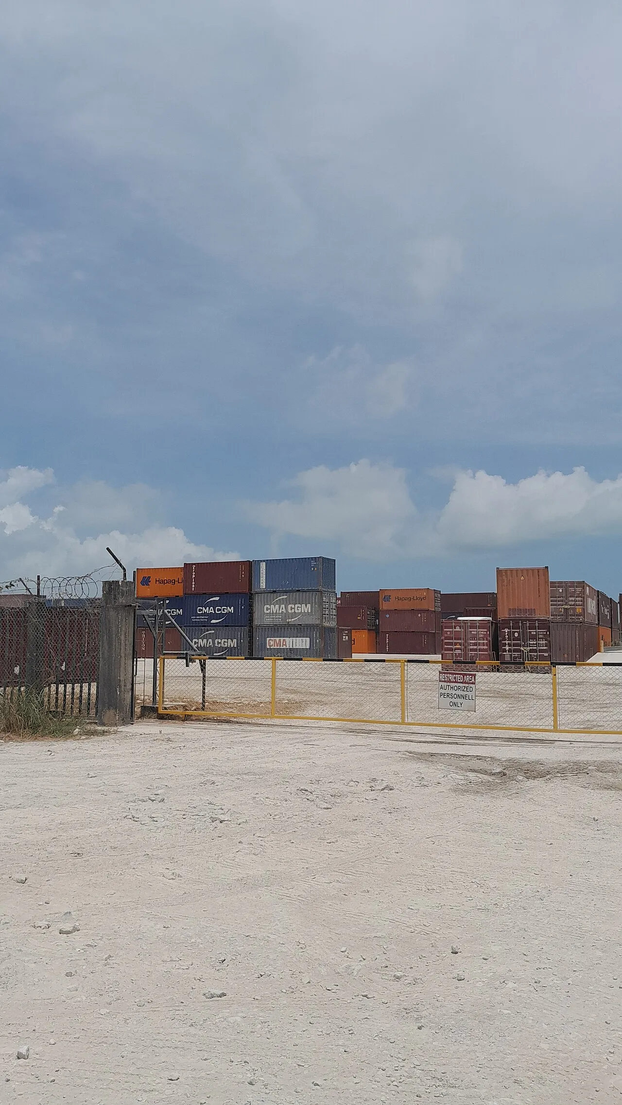 Aerial view of Great Blue Hole underwater sinkhole showing dark blue circle in turquoise reef