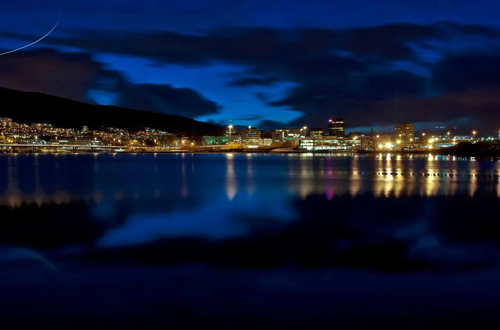 Narrow wooden passage between medieval buildings in Bryggen with cobblestones