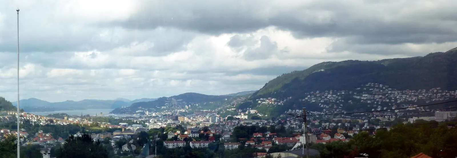 Fresh seafood vendors at Bergen fish mart with displays of salmon shrimp and crab