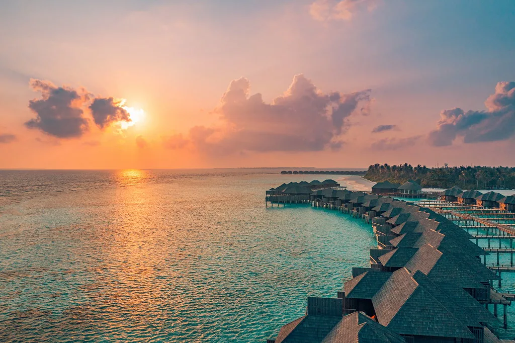 Tender boats at Vaitape pier with turquoise lagoon water
