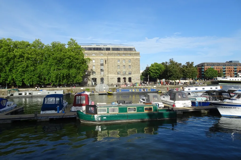 Medieval stone streets of Saint-Émilion village with church spire and terracotta roofs