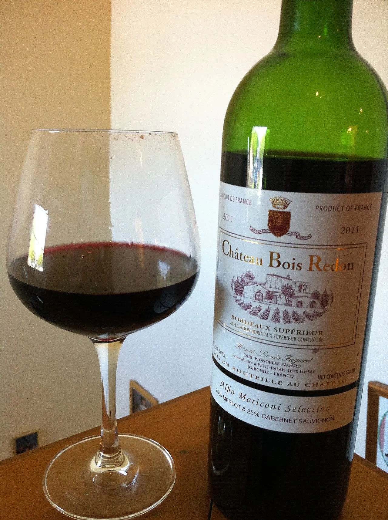 Golden 18th-century façades of Place de la Bourse reflected in Miroir d'Eau with the Garonne River flowing past