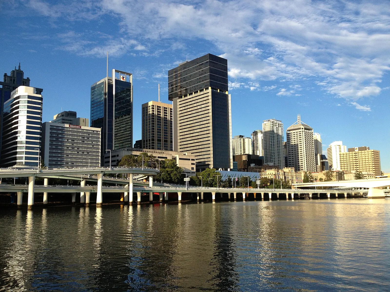 Story Bridge spanning Brisbane River at sunset with city lights