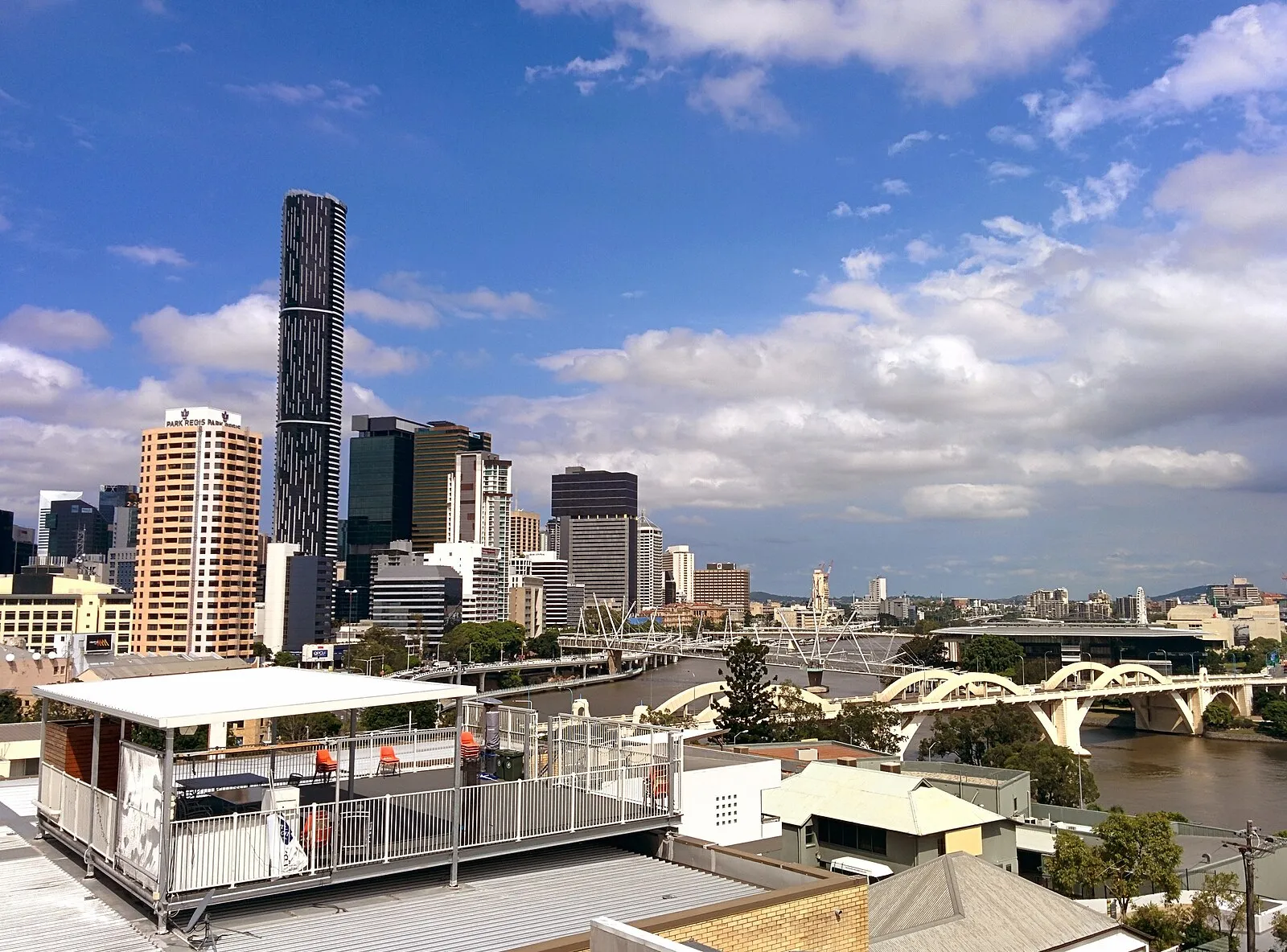 Brisbane skyline and Story Bridge over the Brisbane River with South Bank parklands in foreground