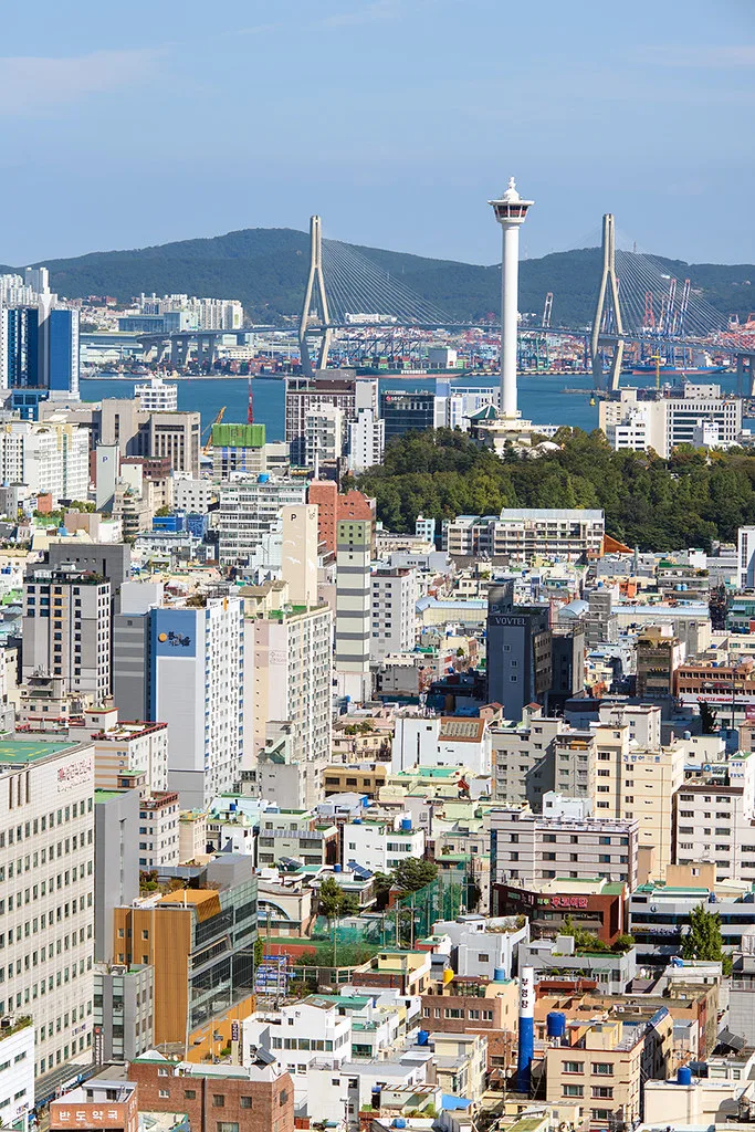 Buddhist statues and traditional architecture at a Busan temple