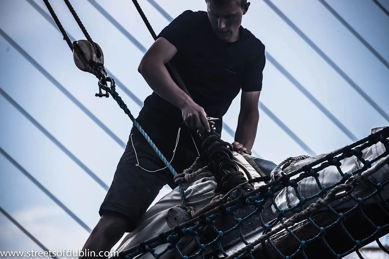 Crescent shaped La Caleta beach with ancient fortress and calm Atlantic waters