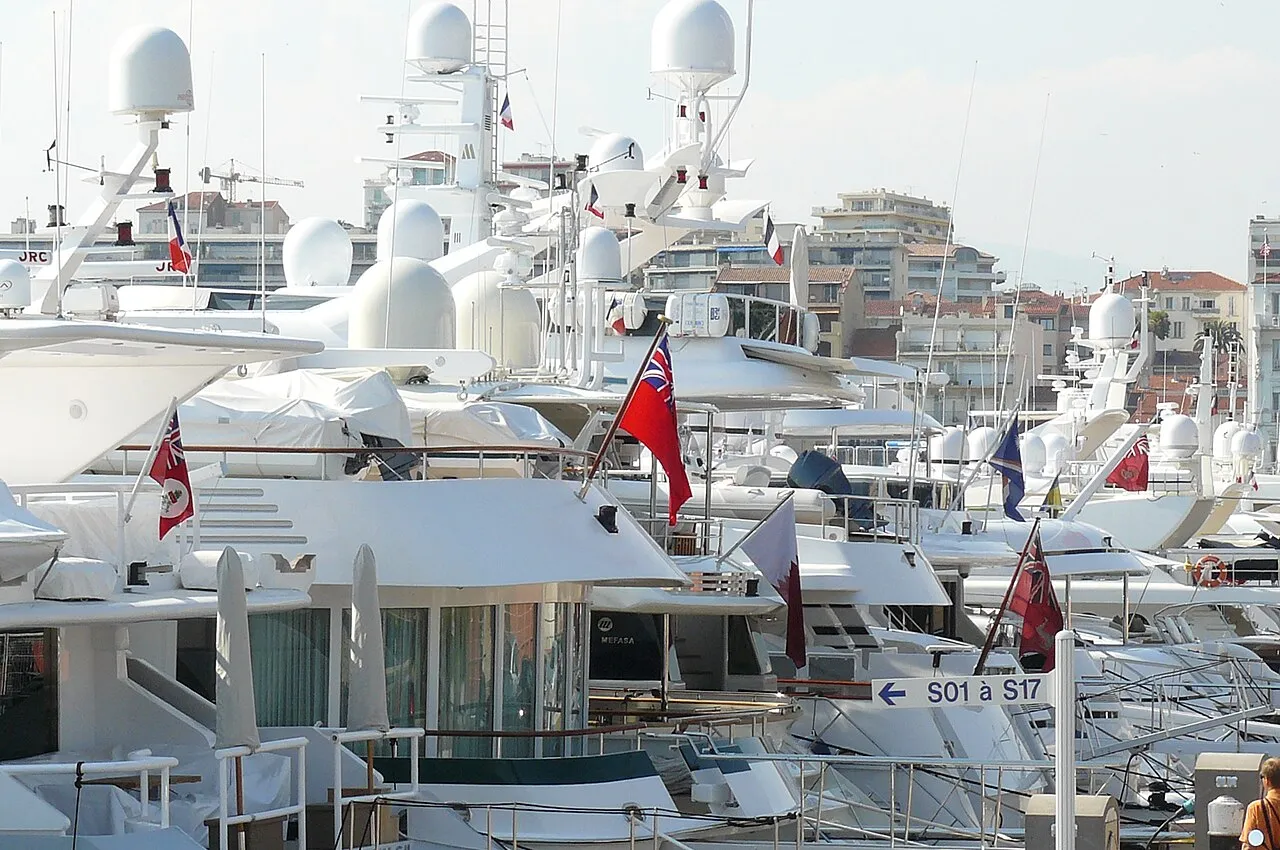 Palm-lined La Croisette promenade with art deco hotels and Mediterranean waterfront