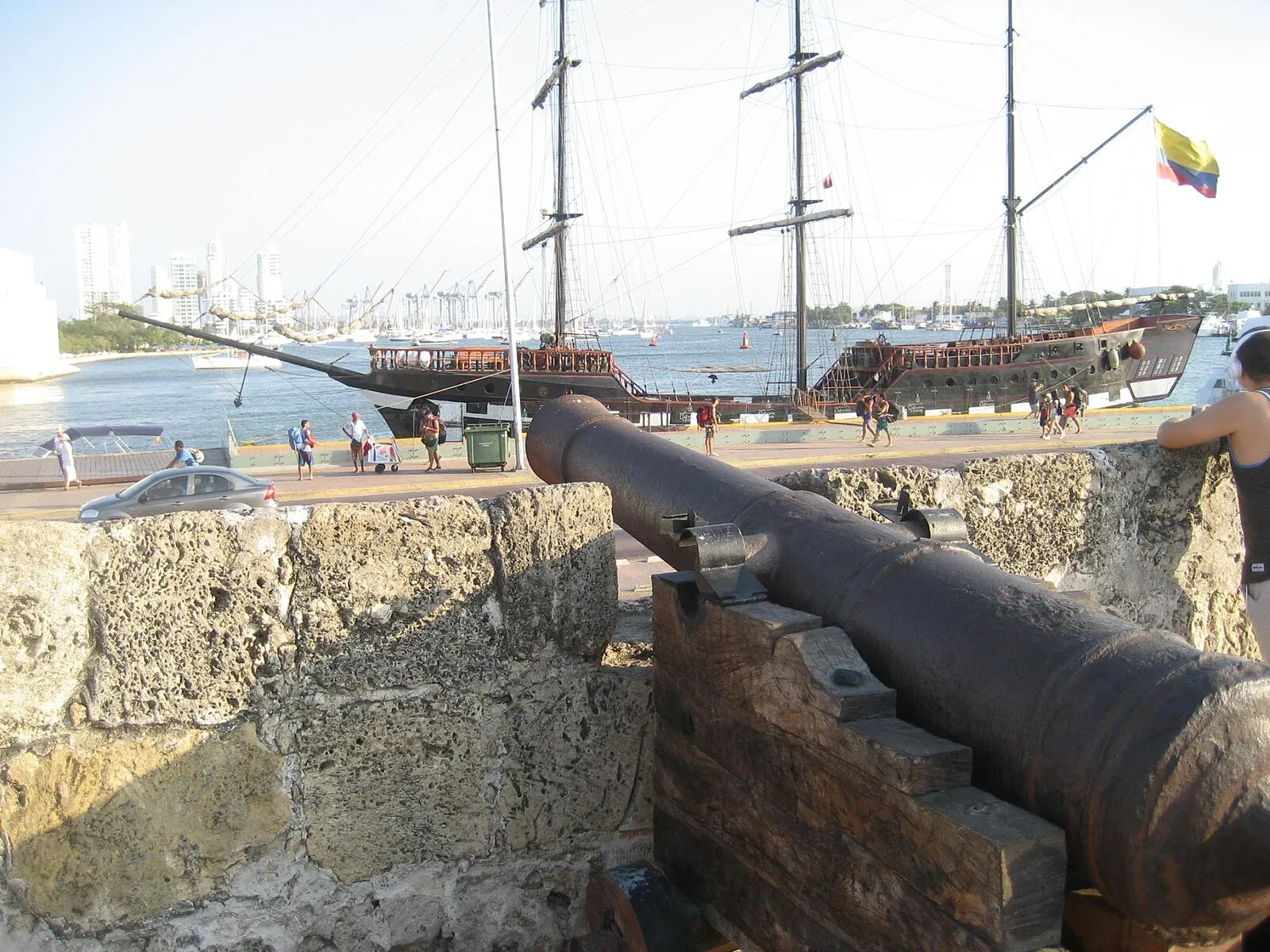 Colonial street with colorful balconies and bougainvillea in Cartagena old town