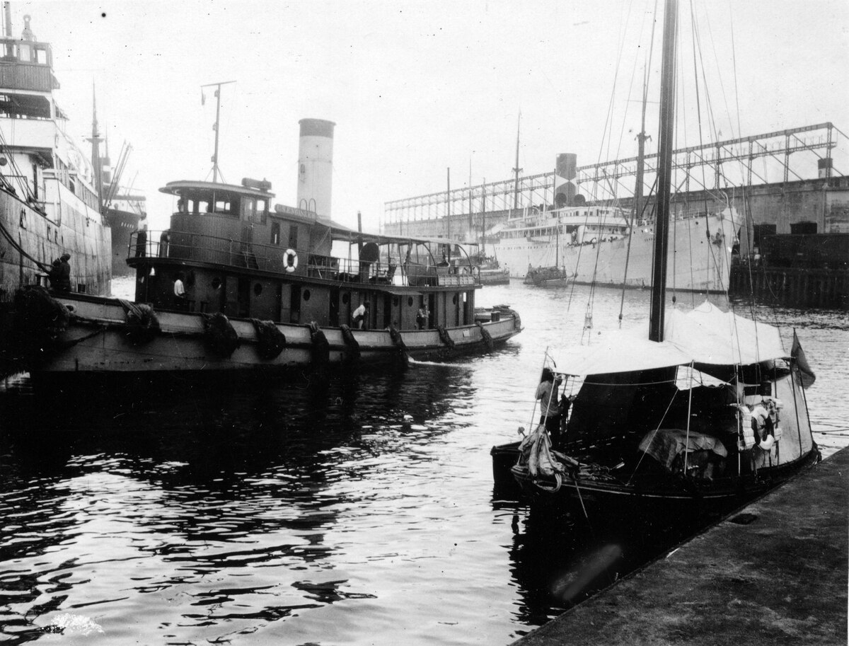 Electric mules guiding ship through Panama Canal lock