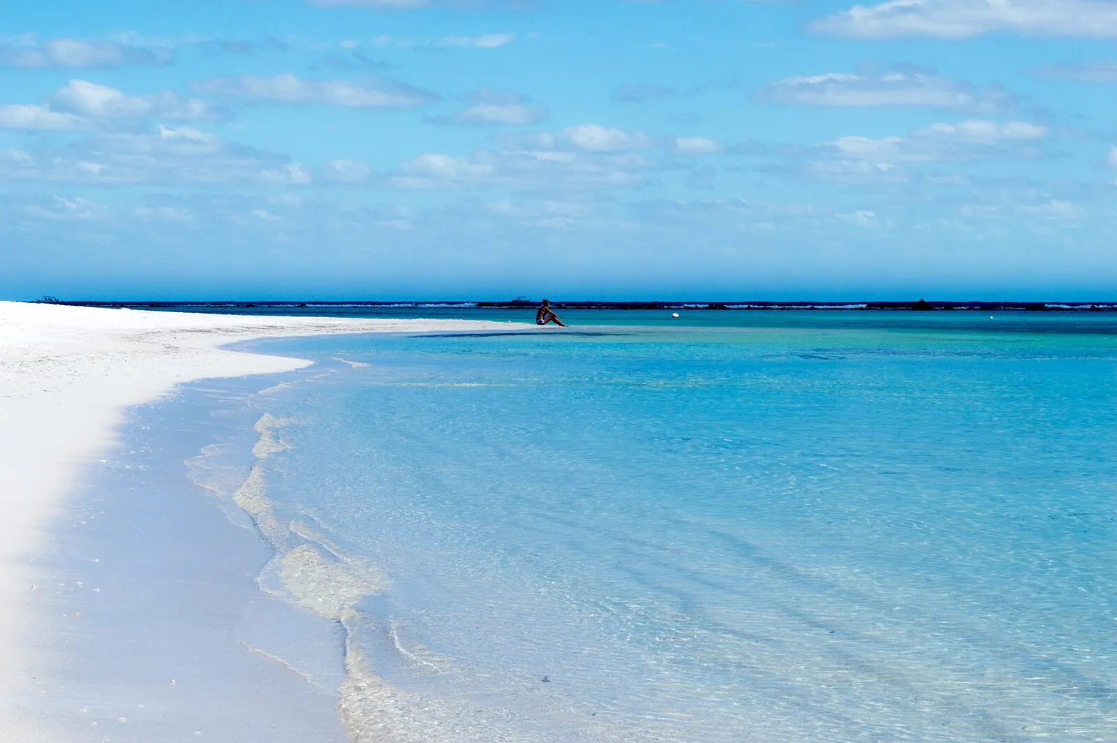 Pristine white sand beach with crystal-clear turquoise water near Costa Maya