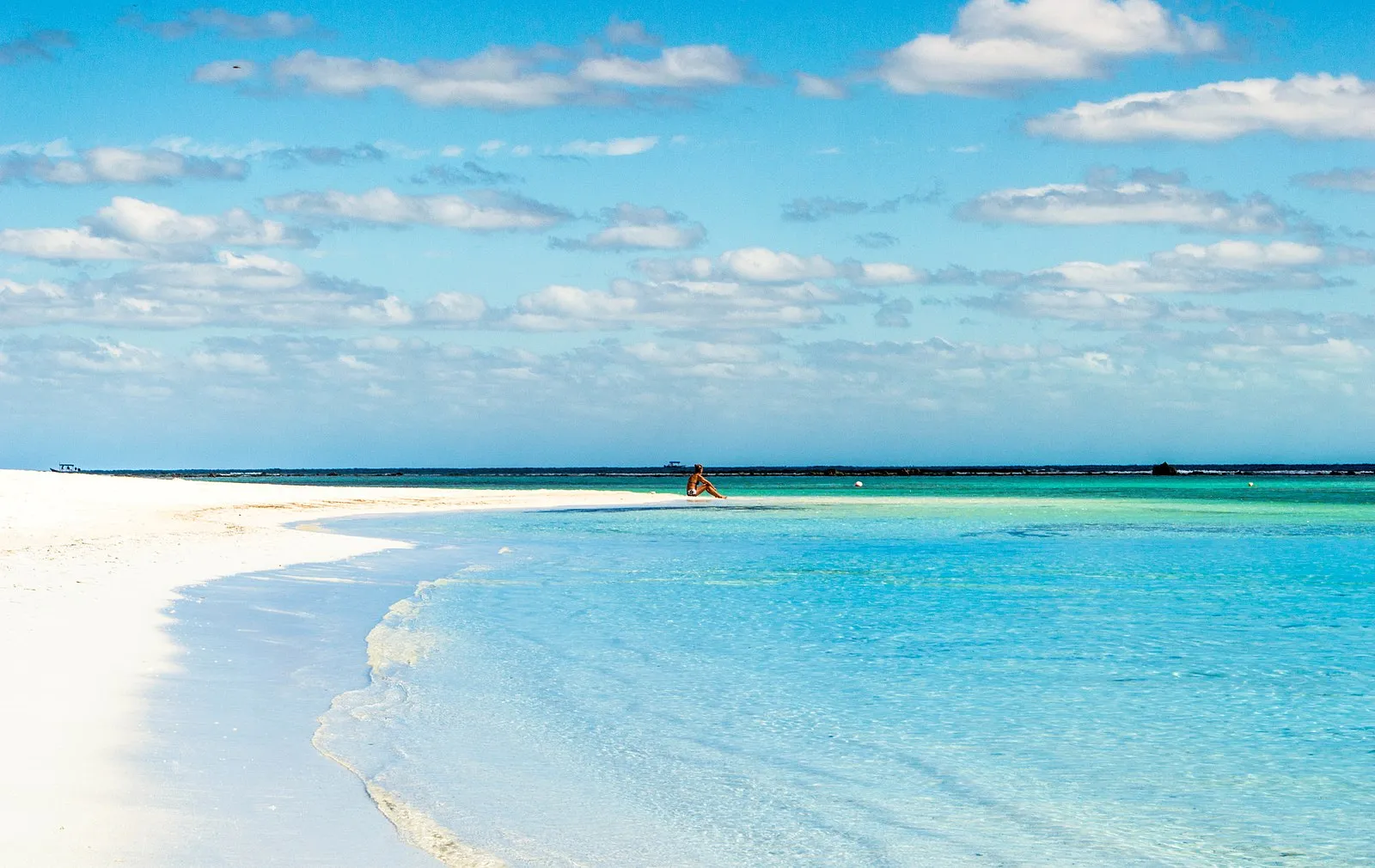 Turquoise Caribbean beach with white sand spit and crystal clear water near Costa Maya