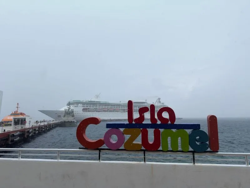 Crystal clear Caribbean waters of Cozumel showing stunning turquoise colors against white sand and tropical coastline