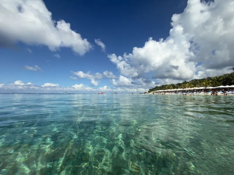 Crystal clear turquoise Caribbean waters of Cozumel coastline with pristine visibility