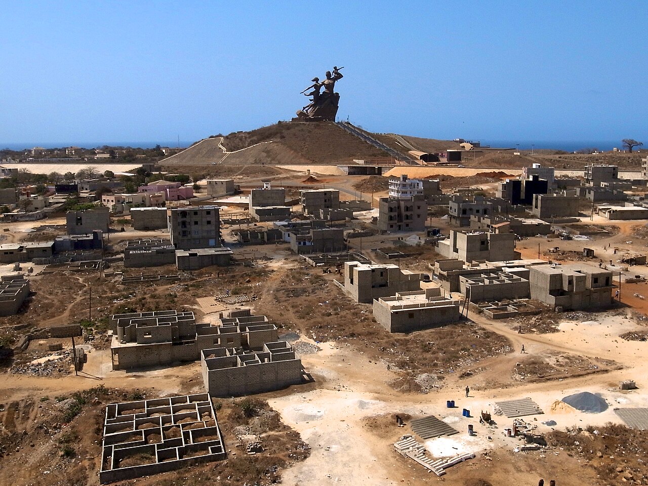 African Renaissance Monument rising above Dakar with construction below