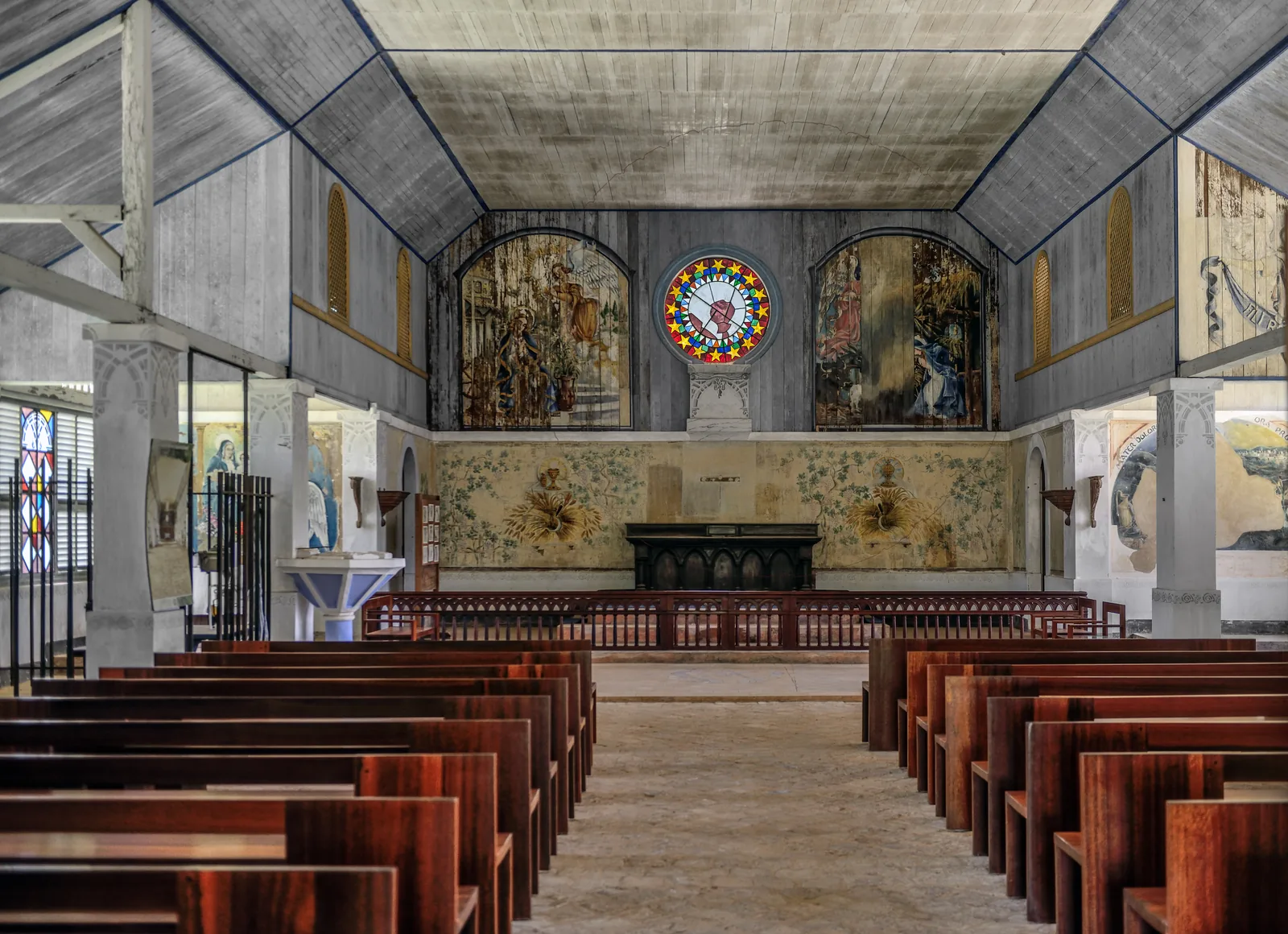 Inside the chapel on Île Royale, its painted walls and simple furnishings intact