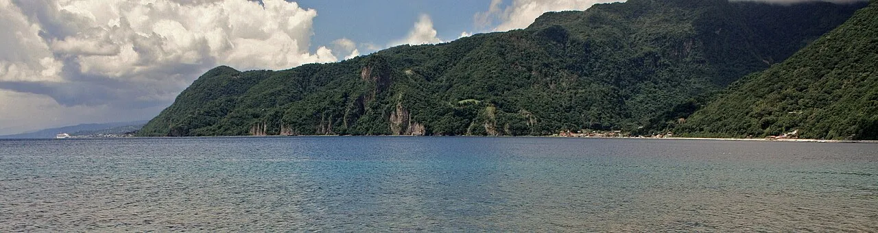 Soufrière Bay coastline showing rugged volcanic cliffs meeting the sea