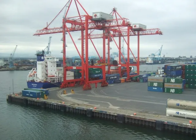 Dublin Port container terminal with red gantry cranes and cargo ships