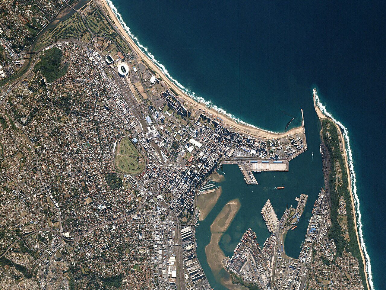 Aerial view of Durban's Golden Mile beachfront with the Indian Ocean sparkling in sunlight beyond the sandy shore