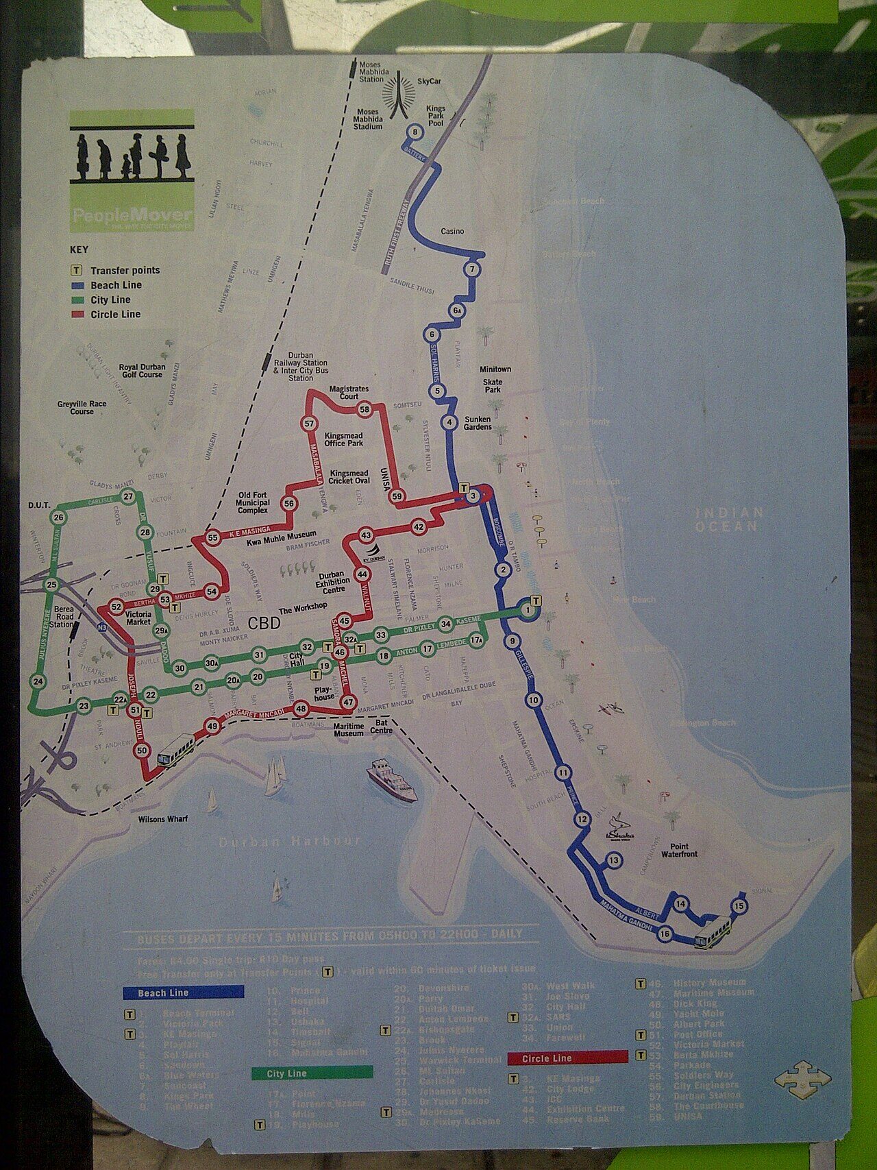 Durban People Mover bus navigating city routes past urban streetscapes and commercial buildings