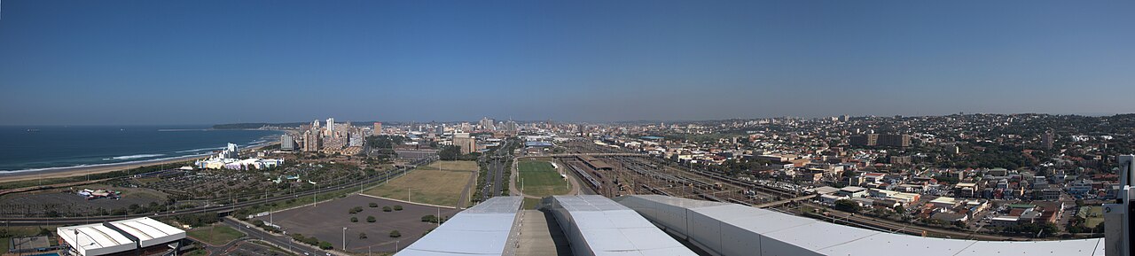 Panoramic view from Moses Mabhida Stadium showing Durban's coastline and city skyline stretching to both horizons