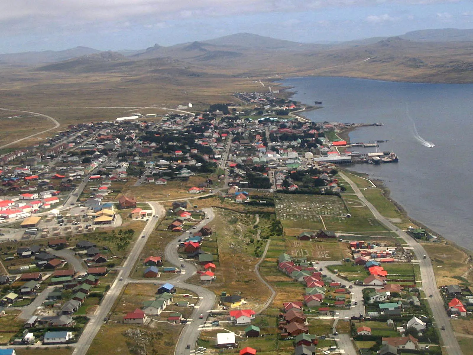 Aerial view of Port Stanley harbor and colorful houses along the waterfront in the Falkland Islands