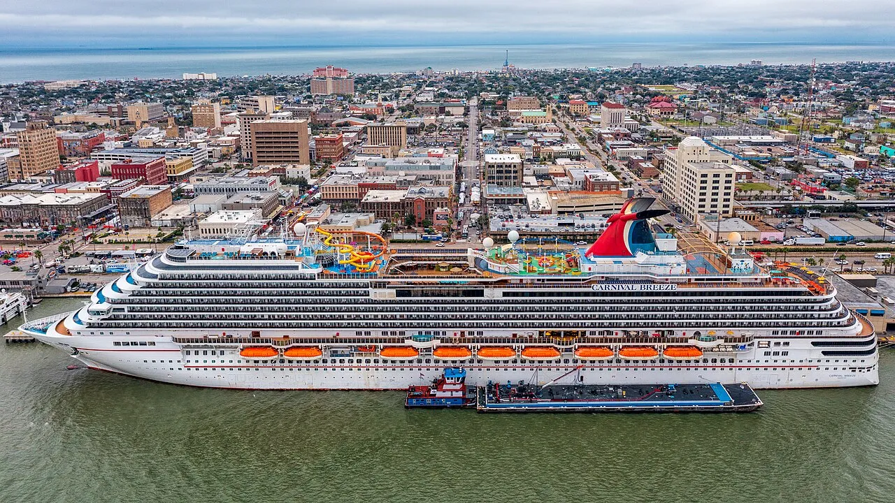 Aerial view of Galveston cruise port with Carnival ship docked and city skyline