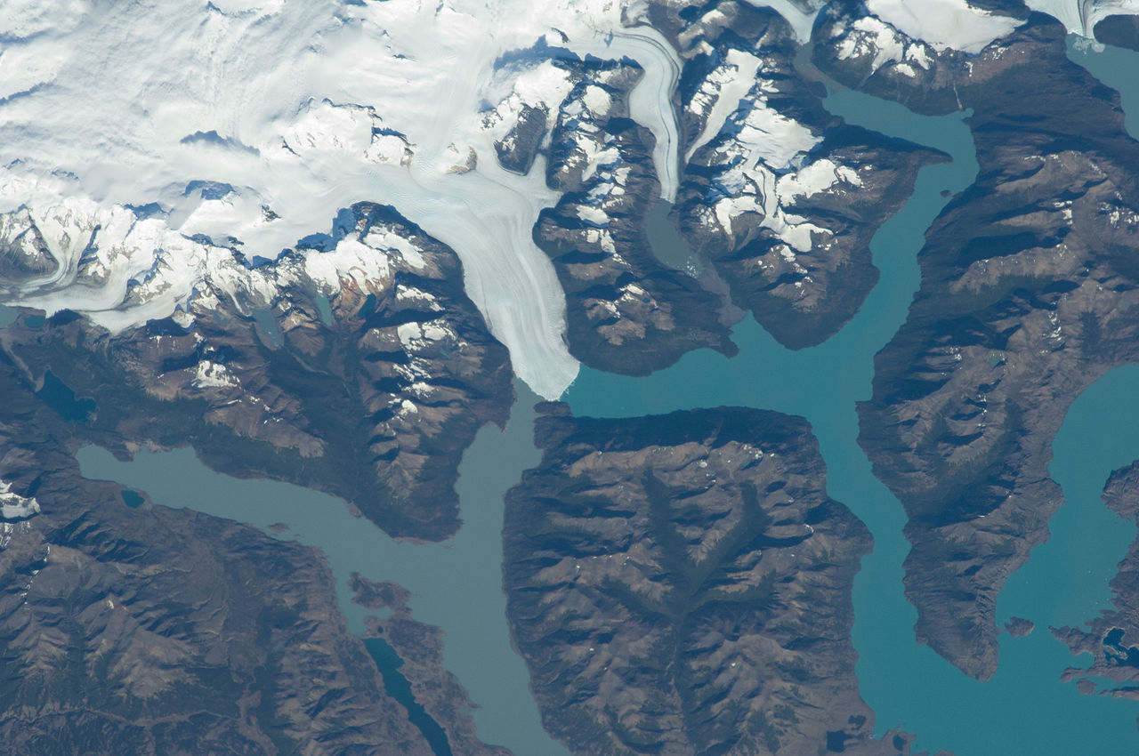 Satellite view of Patagonian ice fields with glaciers flowing into turquoise fjords