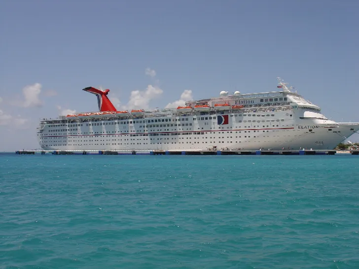 Grand Turk waterfront with colorful buildings and palm trees