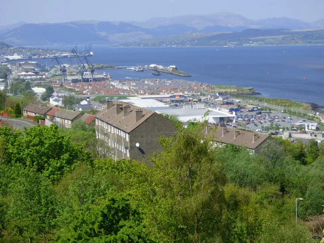 Panoramic hillside view of Greenock, the Firth of Clyde, and Scottish hills beyond