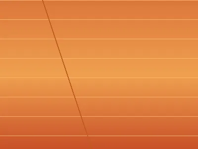 Golden sunset over Ha Long Bay with karst silhouettes reflected in calm water